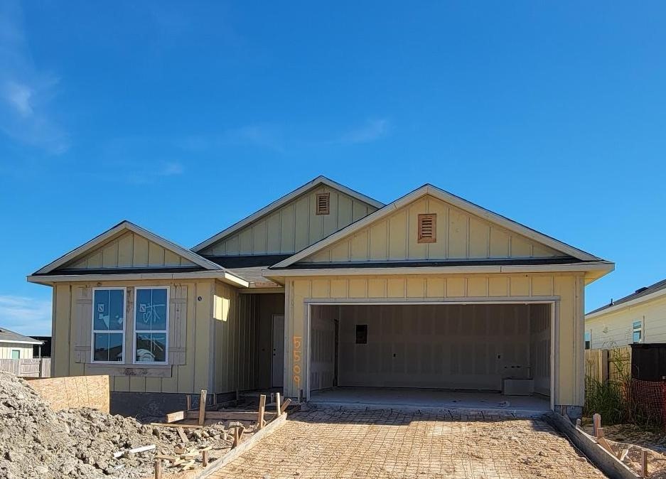 5509 Sacra Cove Austin, TX 78747 - Photo 6 of 38 a front view of a house with a yard
