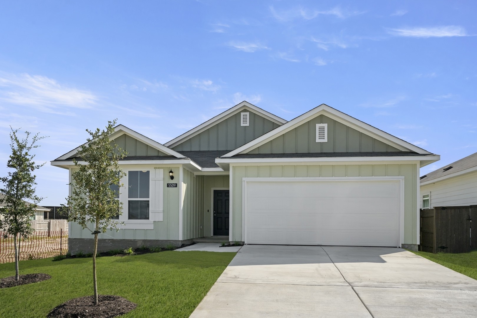 5509 Sacra Cove Austin, TX 78747 - Photo 7 of 38 a front view of a house with a yard