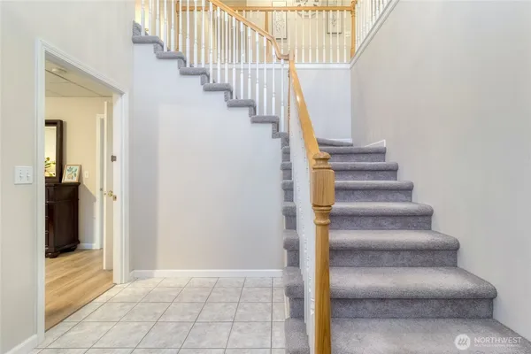 a view of staircase with white walls