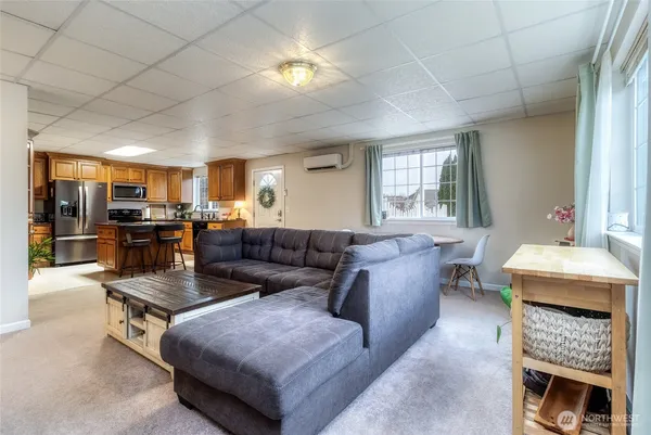 a living room with furniture and a fireplace