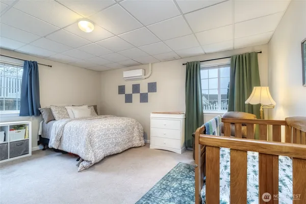 a bedroom with furniture and a window