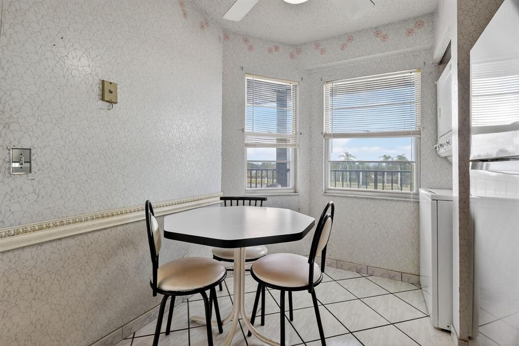 650 Southwest 124th Terrace, Unit 404P Pembroke Pines, FL 33027 - Photo 11 of 26 a dining room with furniture and window