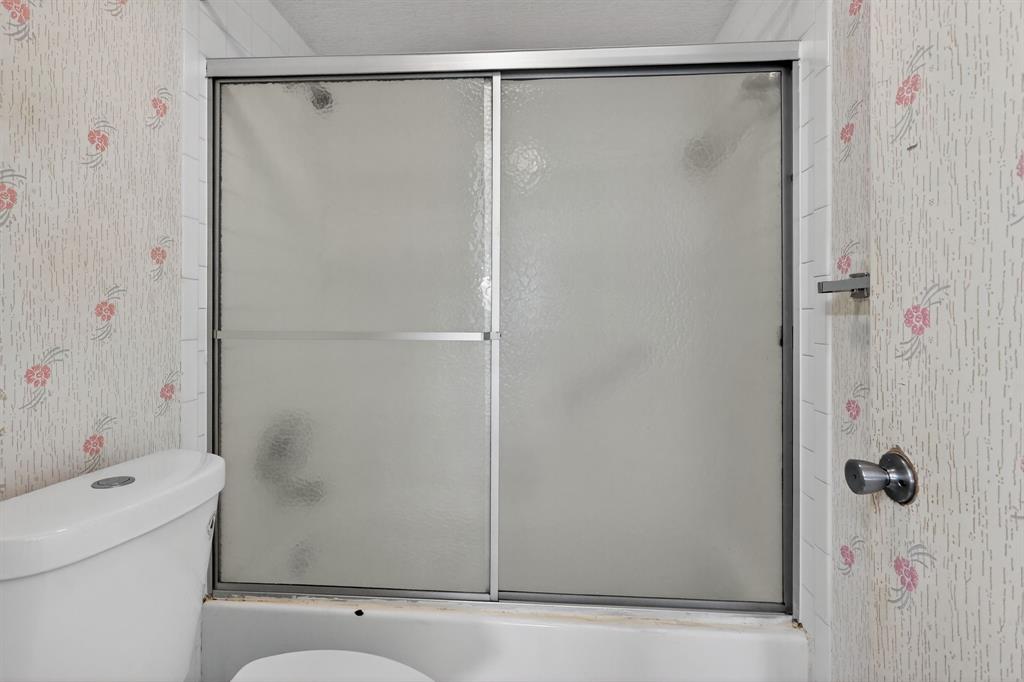 650 Southwest 124th Terrace, Unit 404P Pembroke Pines, FL 33027 - Photo 16 of 26 a bathroom with a shower and a toilet