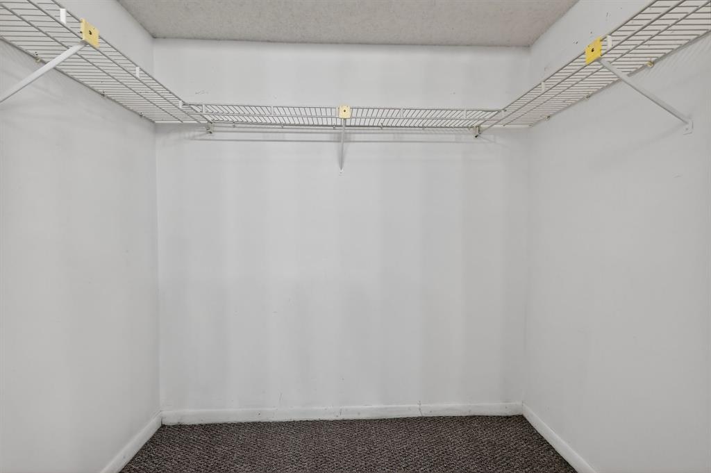 650 Southwest 124th Terrace, Unit 404P Pembroke Pines, FL 33027 - Photo 17 of 26 a view of a room with racks on the wall