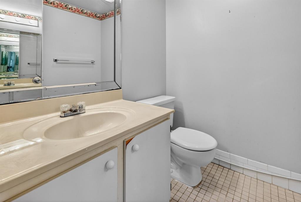 650 Southwest 124th Terrace, Unit 404P Pembroke Pines, FL 33027 - Photo 20 of 26 a bathroom with a sink and a toilet