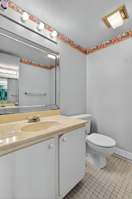 650 Southwest 124th Terrace, Unit 404P Pembroke Pines, FL 33027 - Photo 21 of 26 a bathroom with a granite countertop sink mirror vanity and toilet