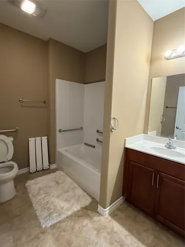 a bathroom with a sink a toilet and bathtub
