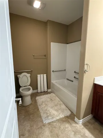 a bathroom with a toilet sink and a bathtub