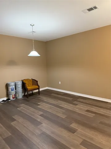 a view of wooden balcony with outdoor seating
