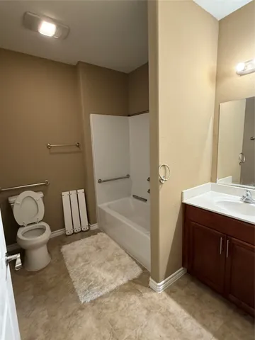 a bathroom with a bathtub sink and toilet