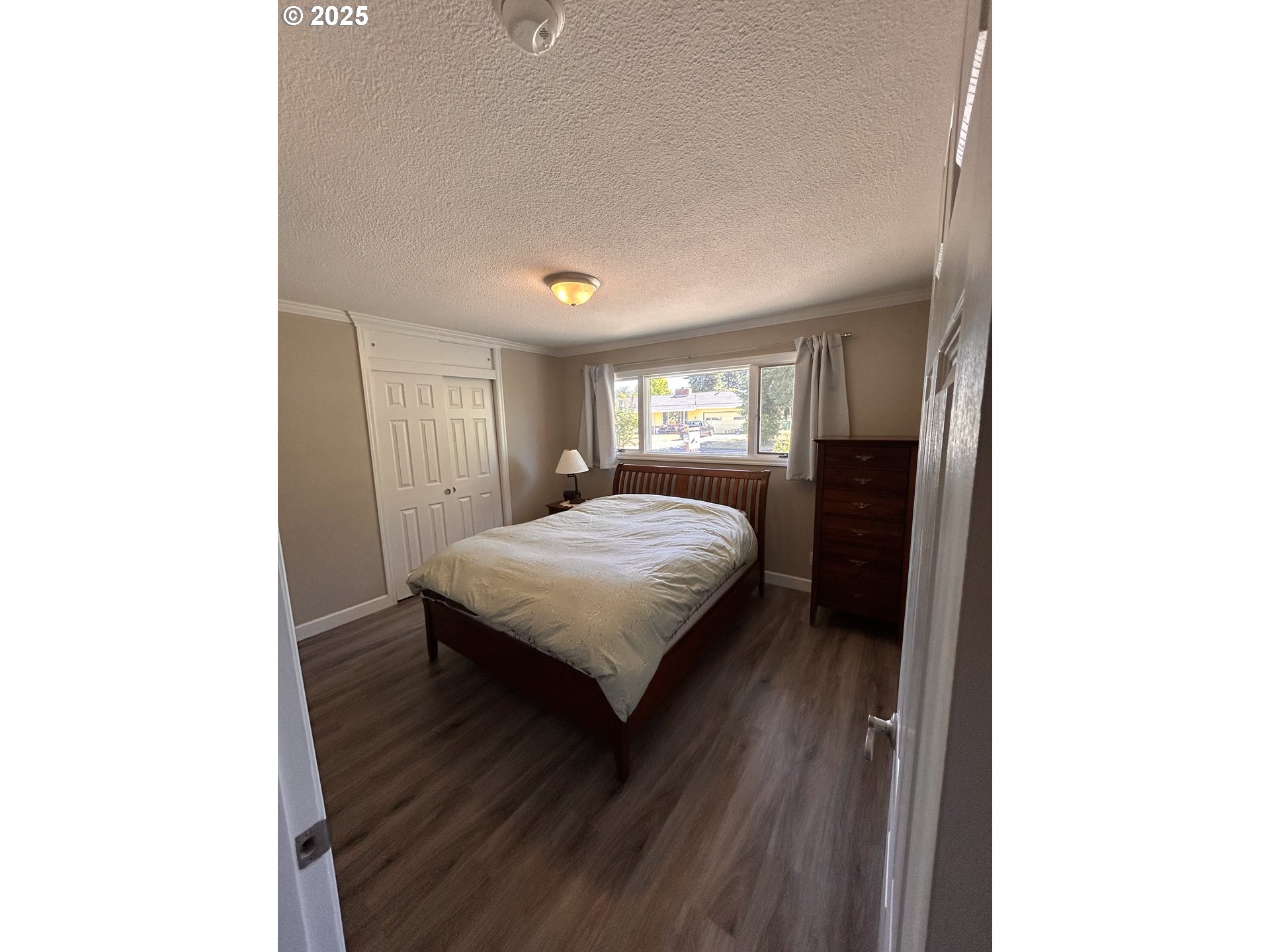 1305 Northeast Newall Road Newberg, OR 97132 - Photo 14 of 21 a spacious bedroom with a bed and a window
