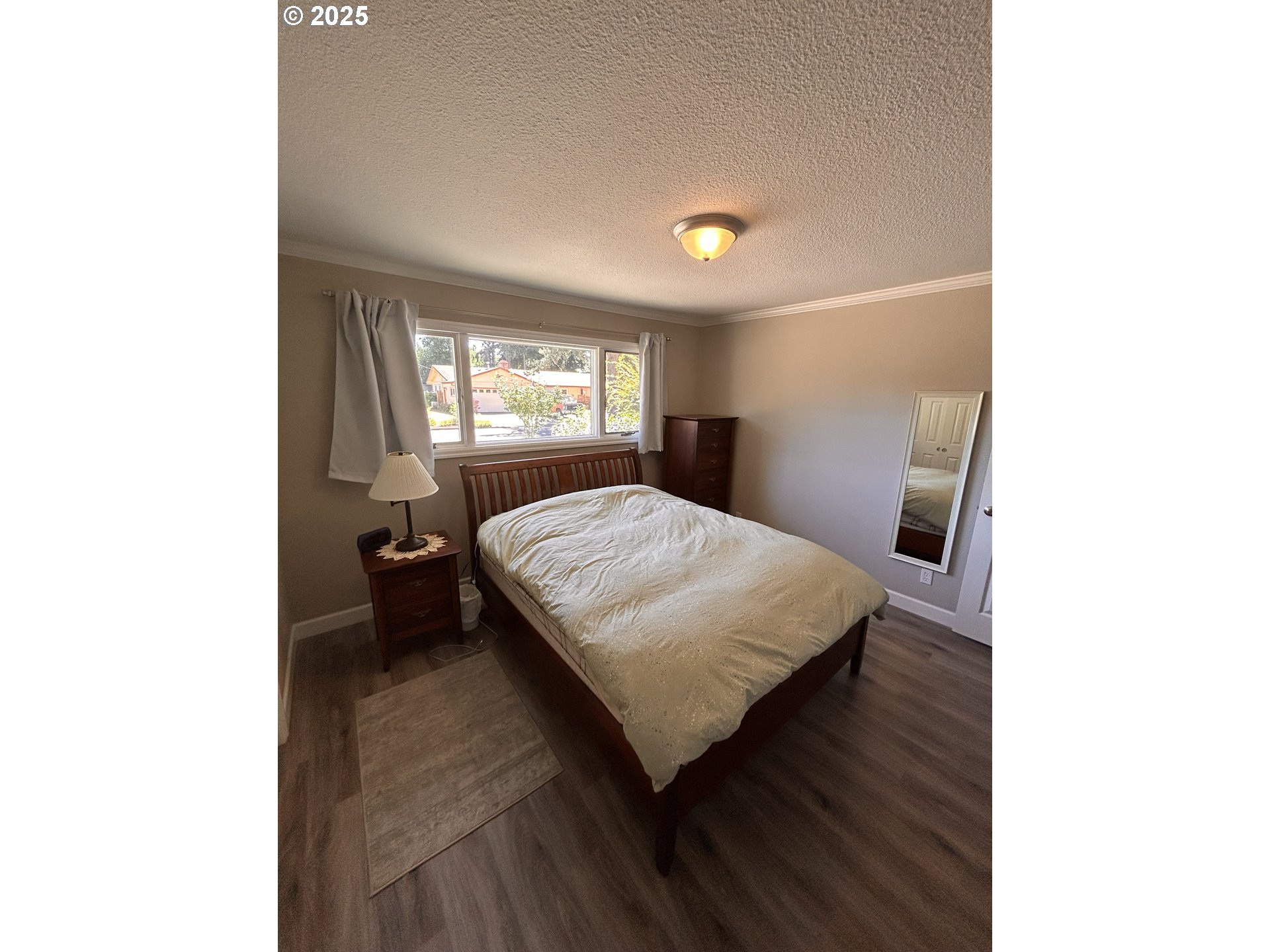 1305 Northeast Newall Road Newberg, OR 97132 - Photo 15 of 21 a bedroom with a bed and window