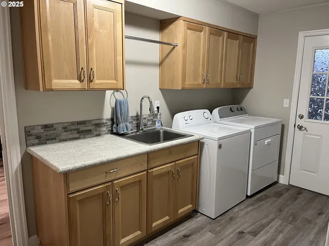 a utility room with dryer and washer