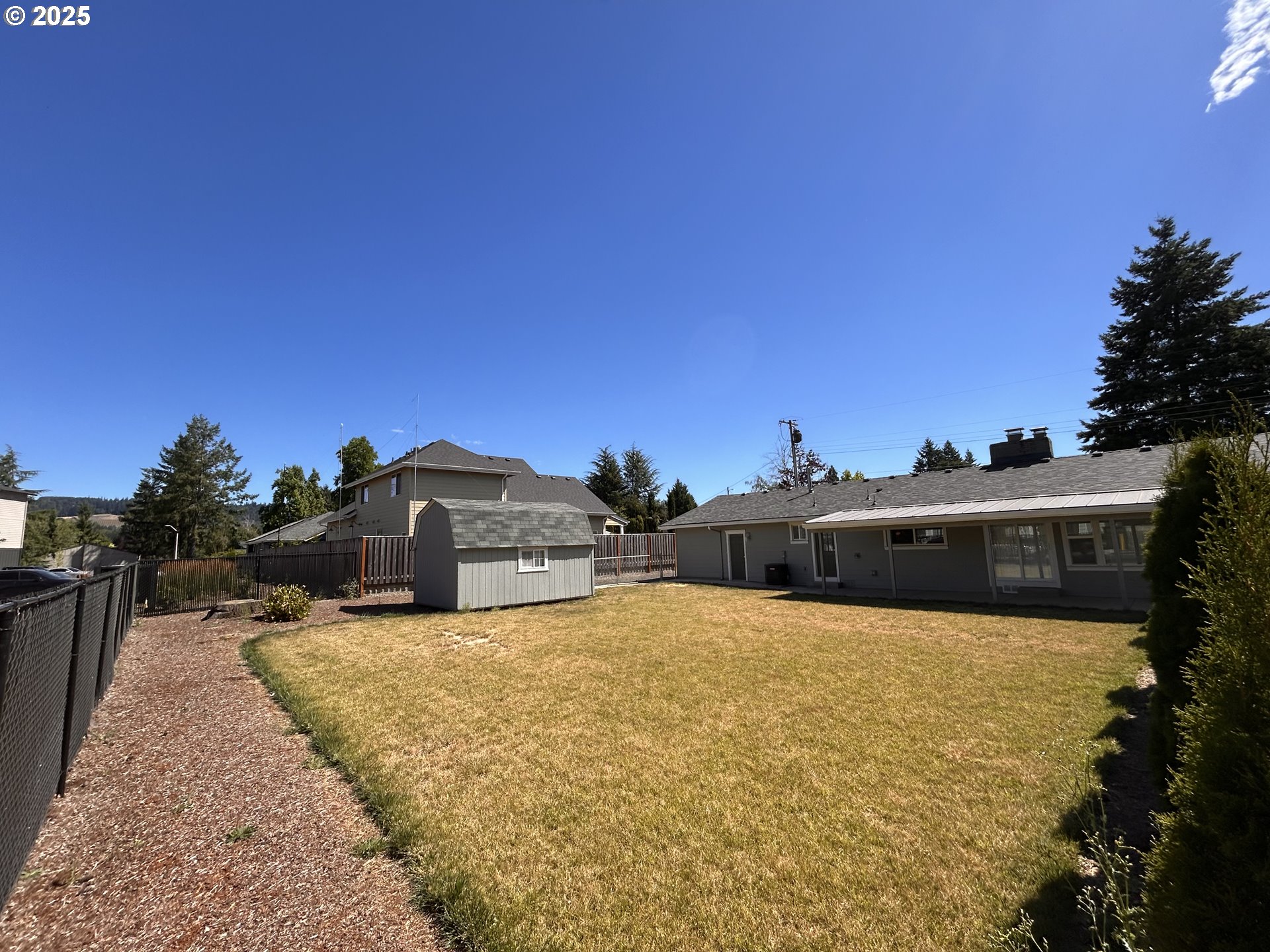 1305 Northeast Newall Road Newberg, OR 97132 - Photo 4 of 21 a view of a outdoor space with trees in the background