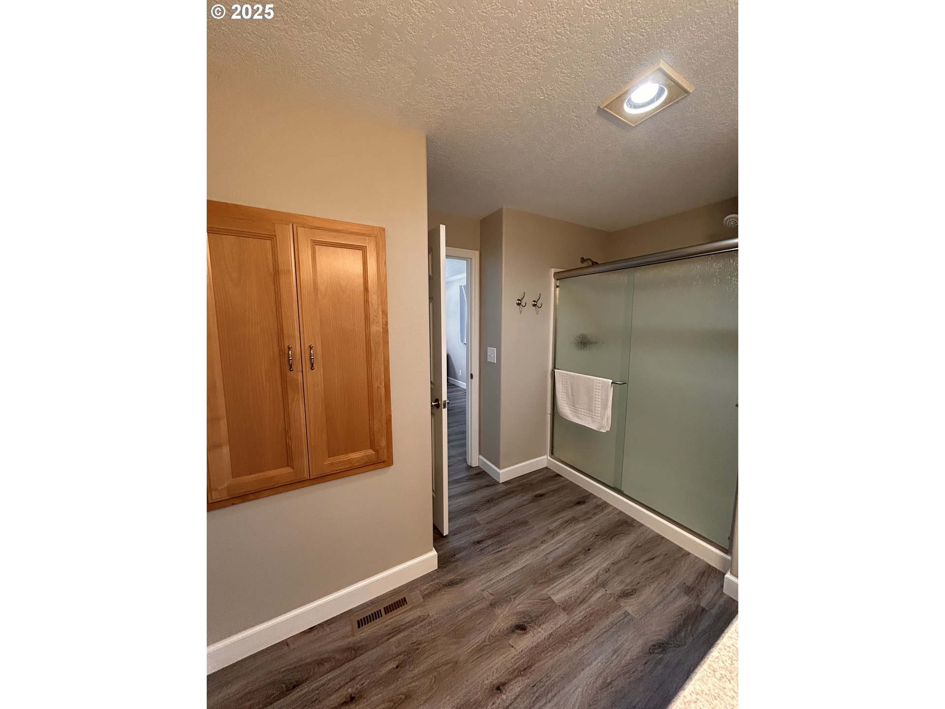 1305 Northeast Newall Road Newberg, OR 97132 - Photo 6 of 21 a view of a hallway with wooden floor