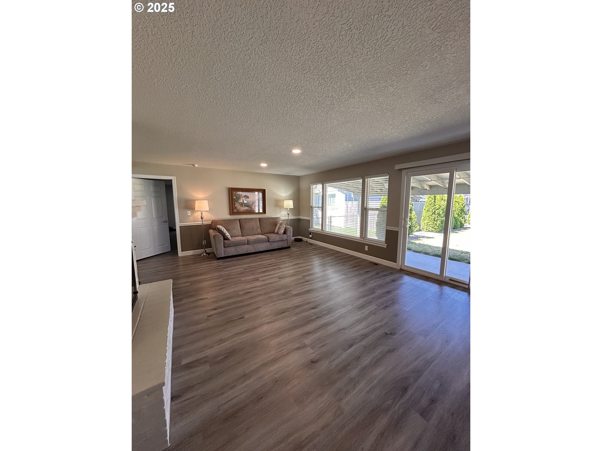 1305 Northeast Newall Road Newberg, OR 97132 - Photo 8 of 21 a living room with furniture and a wooden floor