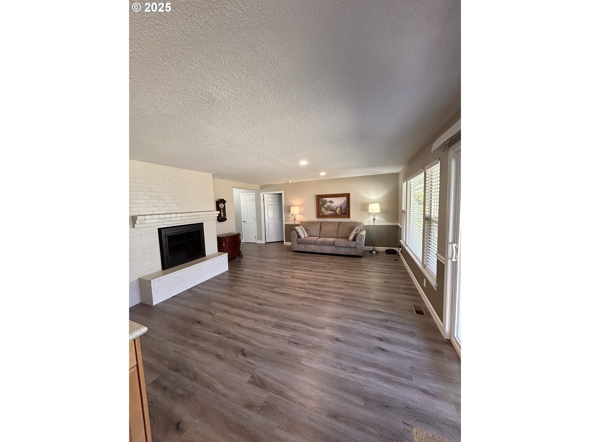 1305 Northeast Newall Road Newberg, OR 97132 - Photo 9 of 21 a view of living room with furniture and fireplace