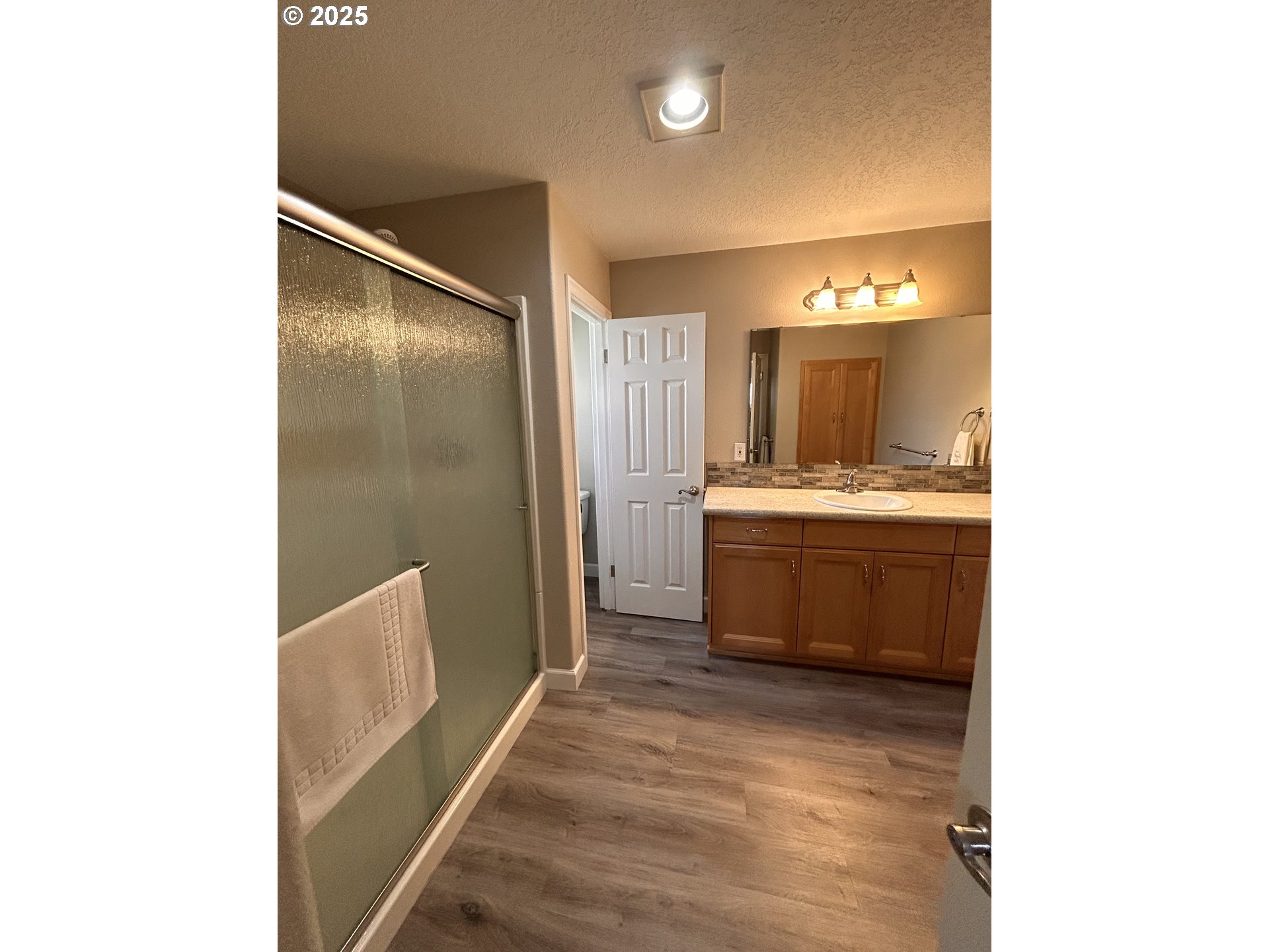 1305 Northeast Newall Road Newberg, OR 97132 - Photo 10 of 21 a bathroom with a sink a toilet and mirror