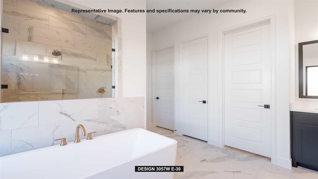 1908 Vantage Drive Rockwall, TX 75087 - Photo 8 of 17 a bathroom with a bathtub and a shower