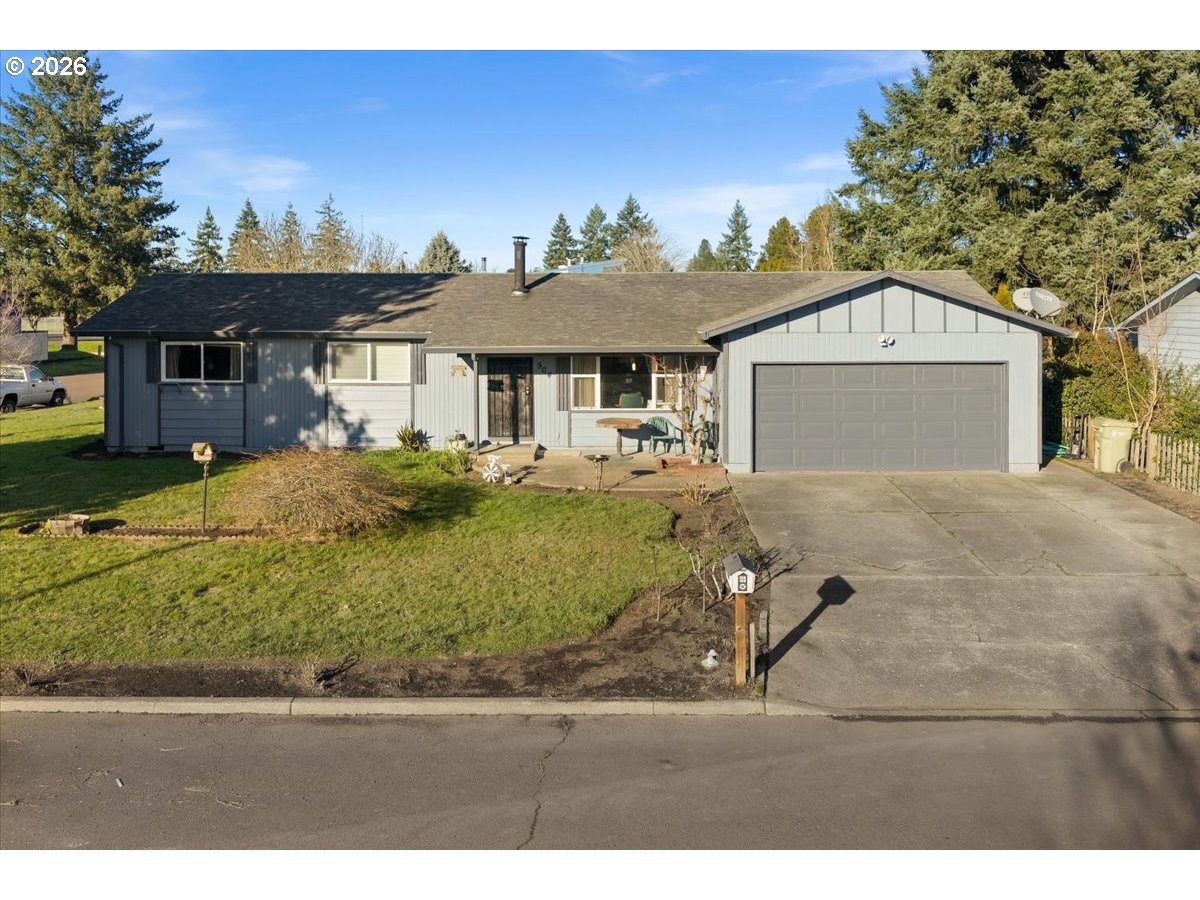 904 South Magnolia Street Cornelius, OR 97113 - Photo 1 of 28 a front view of a house with a yard and garage