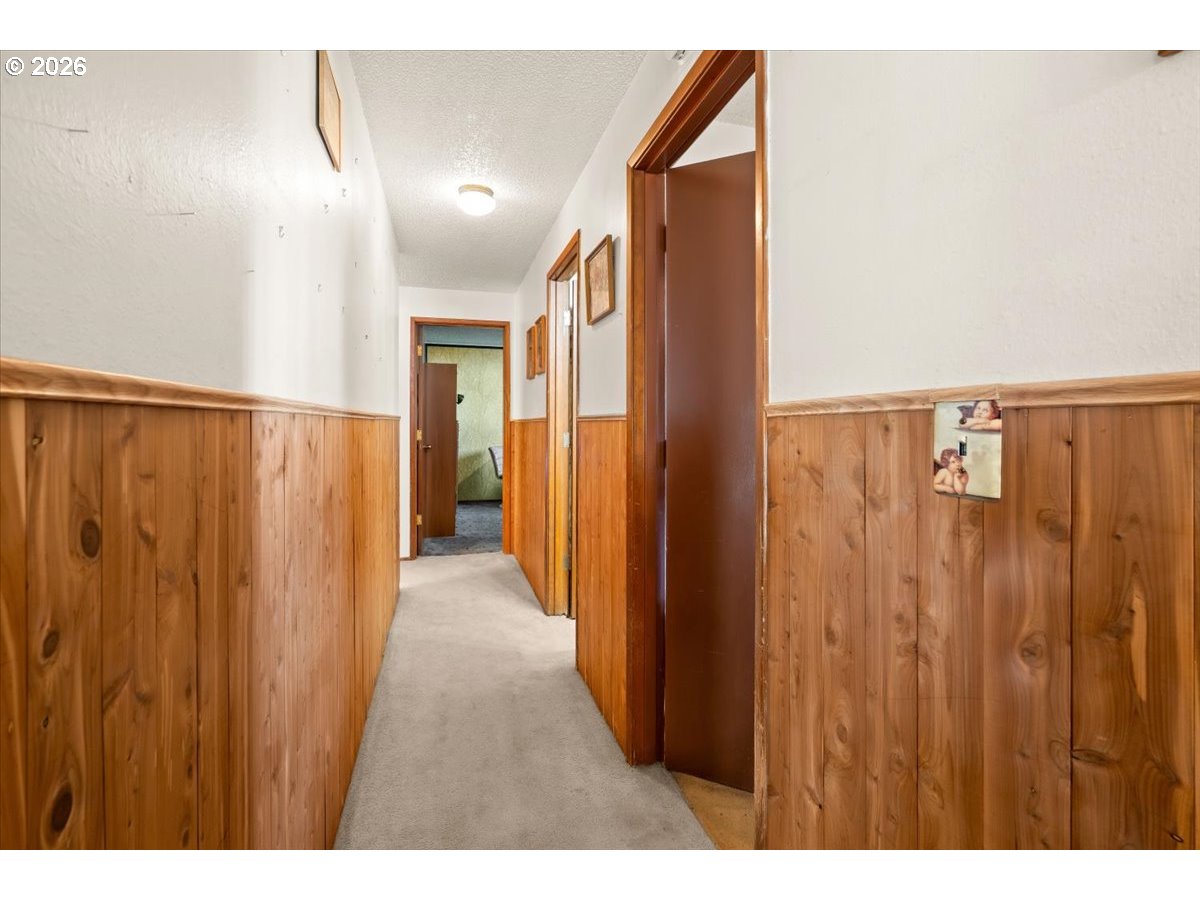 904 South Magnolia Street Cornelius, OR 97113 - Photo 16 of 28 a view of a hallway with wooden floor