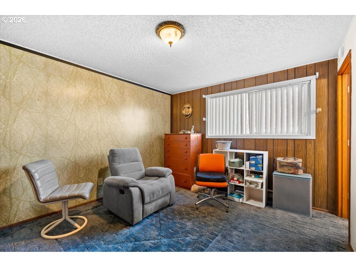 904 South Magnolia Street Cornelius, OR 97113 - Photo 10 of 28 a living room with furniture and a lamp