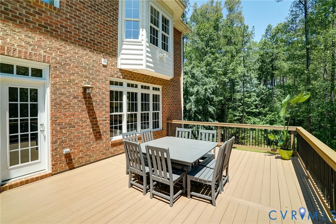 1295 Hermitage Road Manakin-Sabot, VA 23103 - Photo 14 of 55 a view of a patio with a table and chairs
