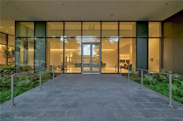 a view of an empty room with a large window