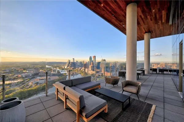 a view of roof deck with seating space and a potted plants