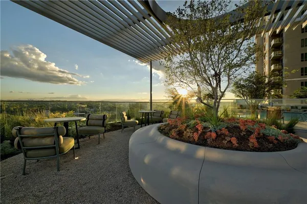 a view of a swimming pool and lounge chair