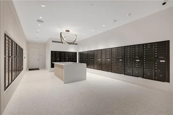 a large room with a large window and chandelier