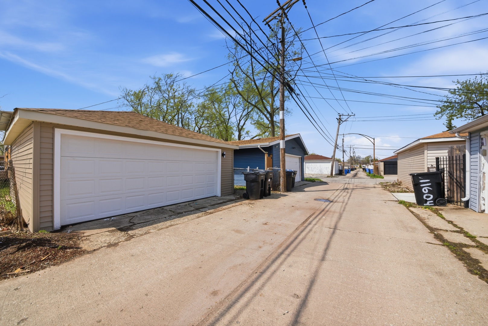 11603 South Loomis Street Chicago, IL 60643 - Photo 21 of 26 a front view of a house with a yard and garage