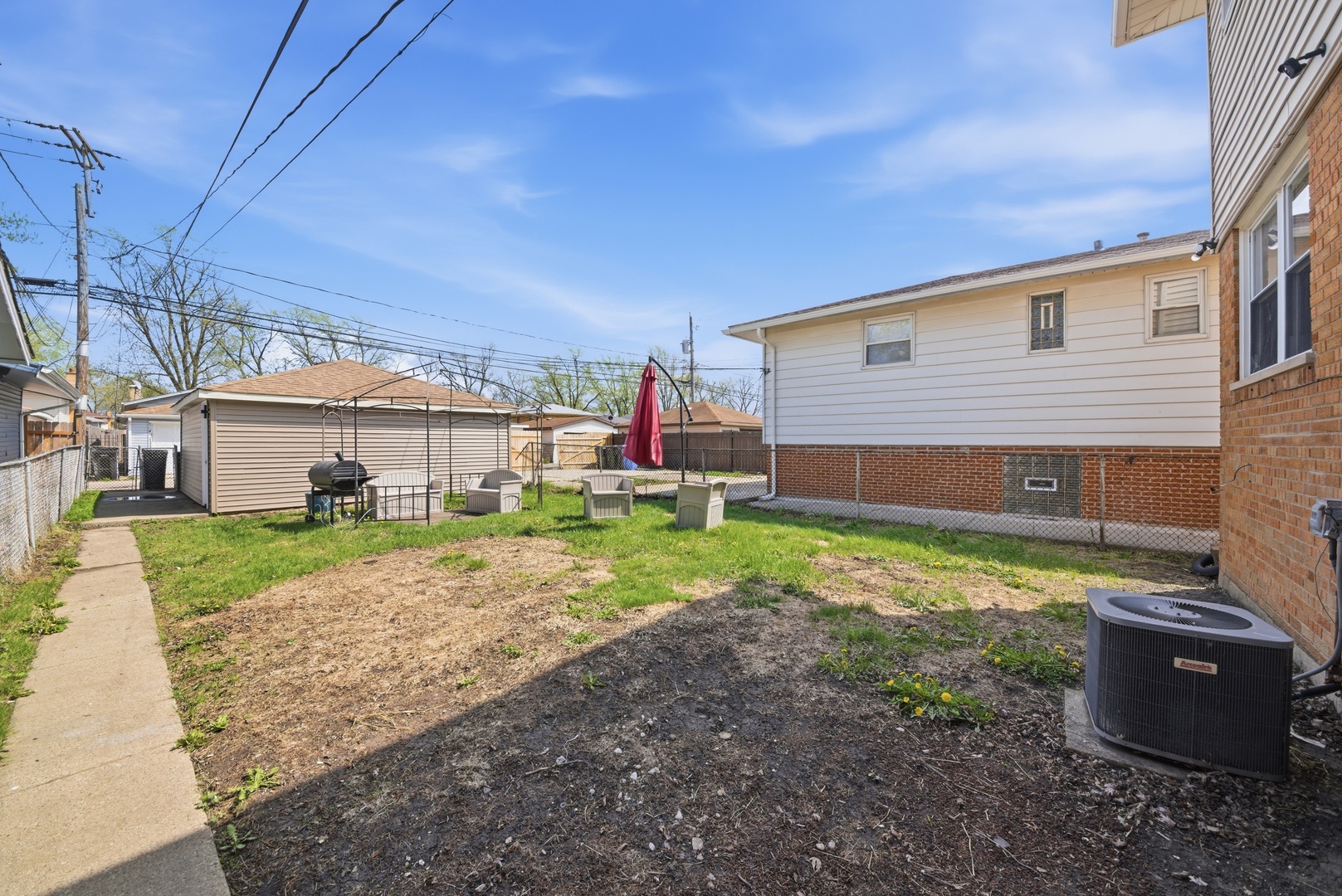 11603 South Loomis Street Chicago, IL 60643 - Photo 22 of 26 a view of a house with backyard and a garden