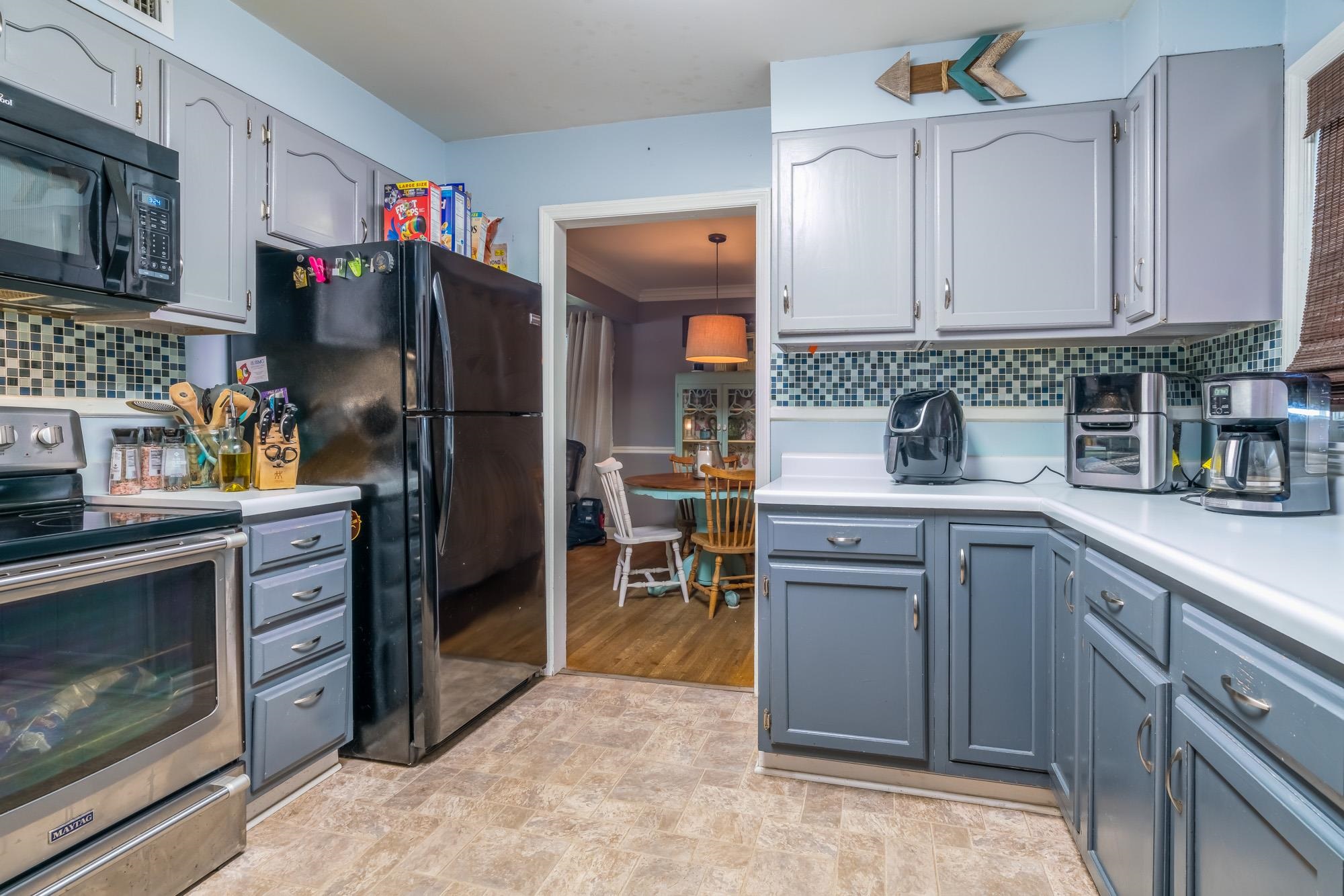 1632 South Perkins Road Memphis, TN 38117 - Photo 12 of 25 a kitchen with stainless steel appliances granite countertop a refrigerator and a stove top oven