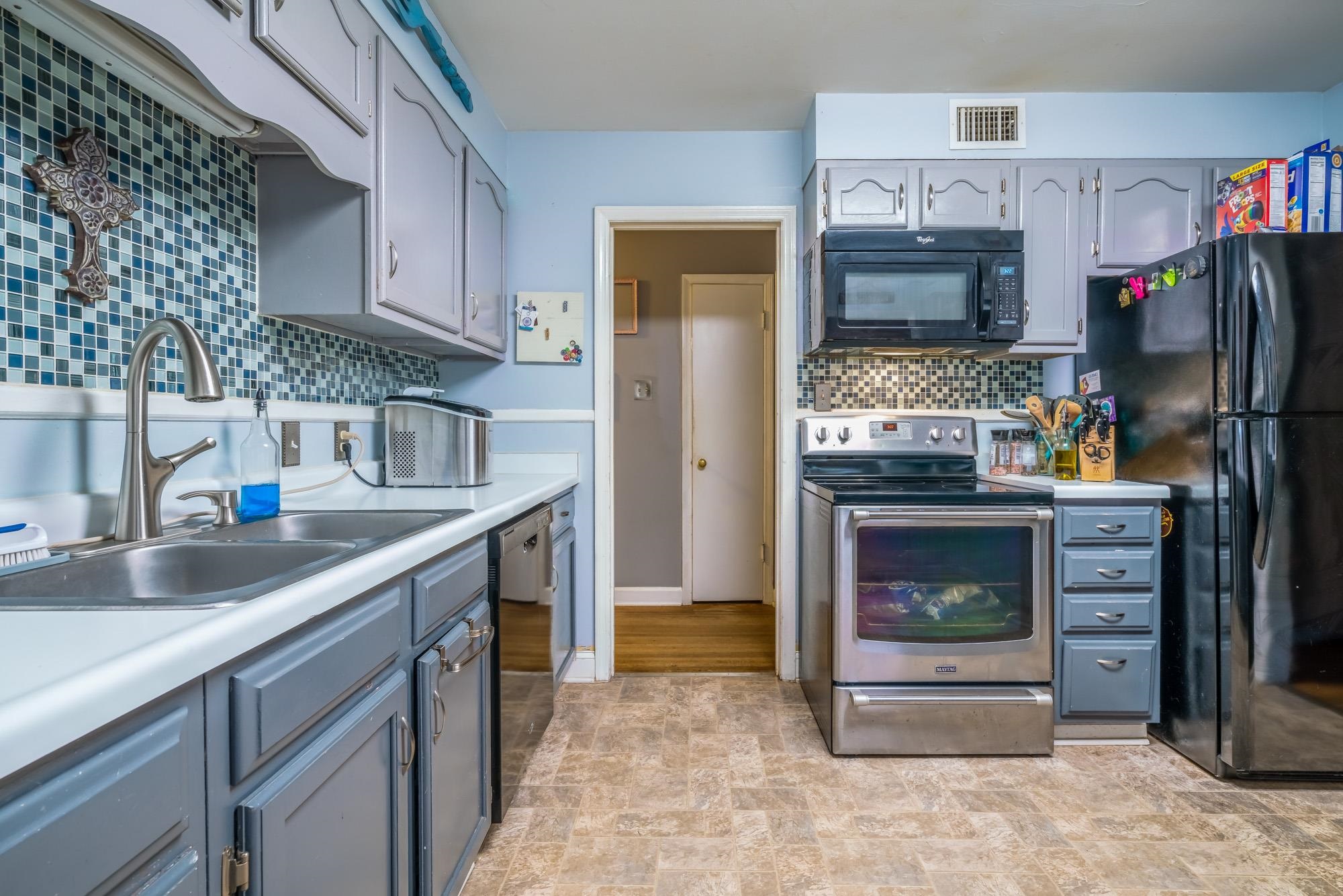 1632 South Perkins Road Memphis, TN 38117 - Photo 13 of 25 a kitchen with stainless steel appliances kitchen island a stove and a sink
