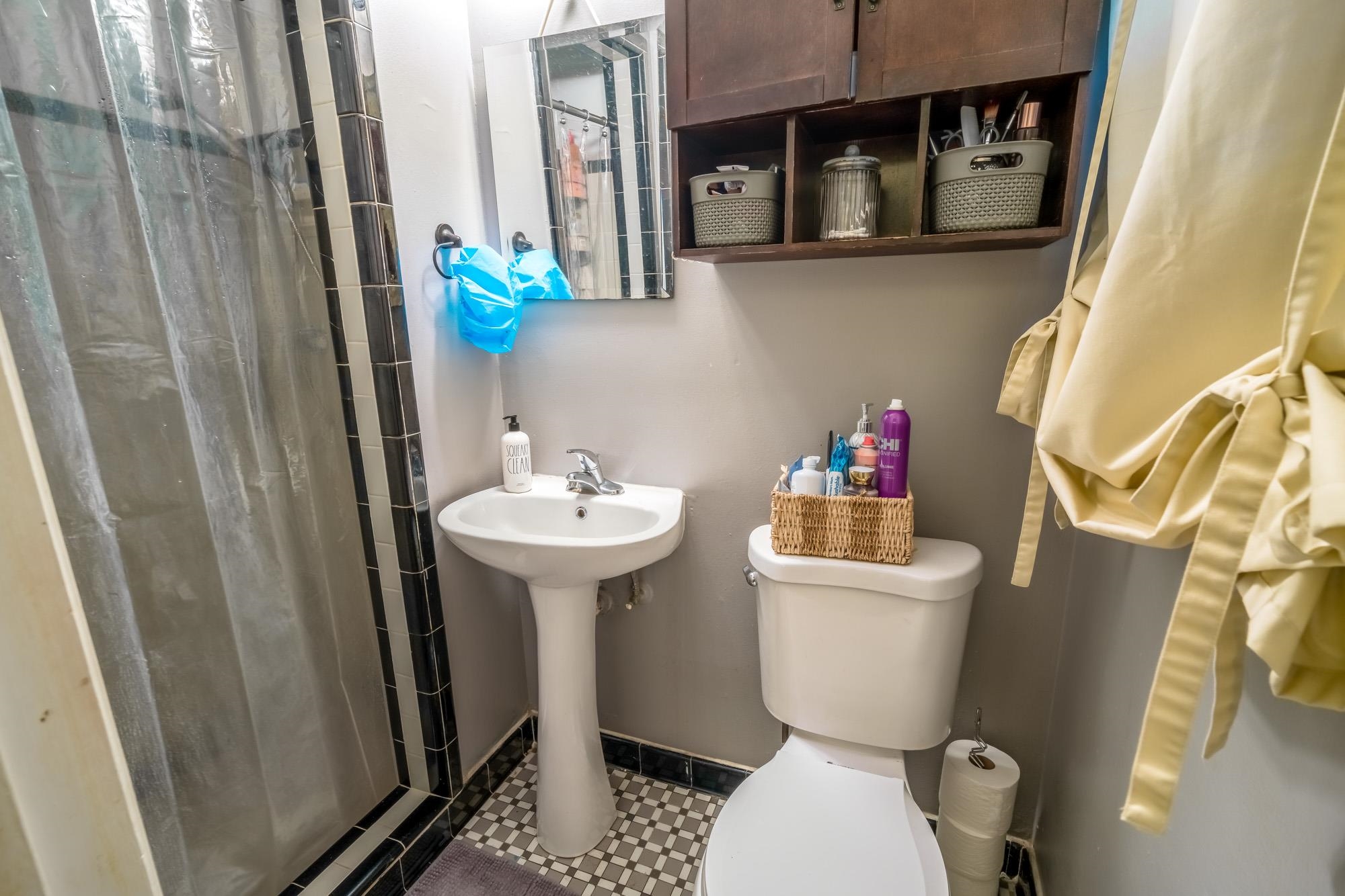 1632 South Perkins Road Memphis, TN 38117 - Photo 18 of 25 a bathroom with a sink a toilet and shower curtain