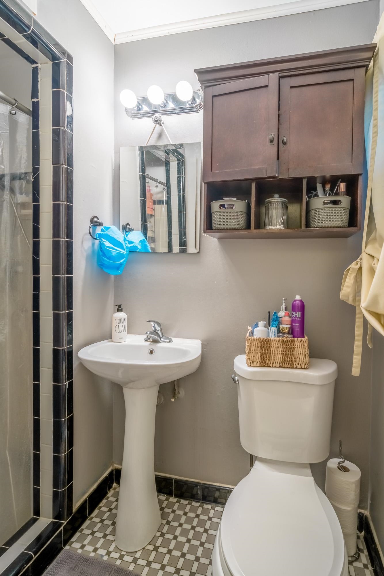 1632 South Perkins Road Memphis, TN 38117 - Photo 19 of 25 a bathroom with a sink mirror toilet and shower