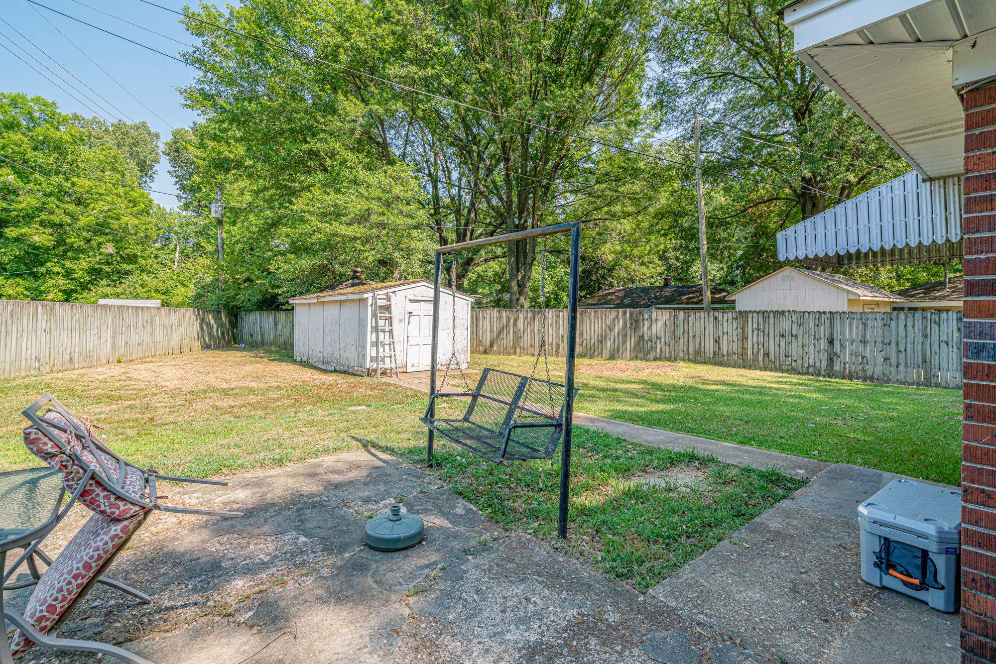 1632 South Perkins Road Memphis, TN 38117 - Photo 23 of 25 a view of a backyard with swimming pool