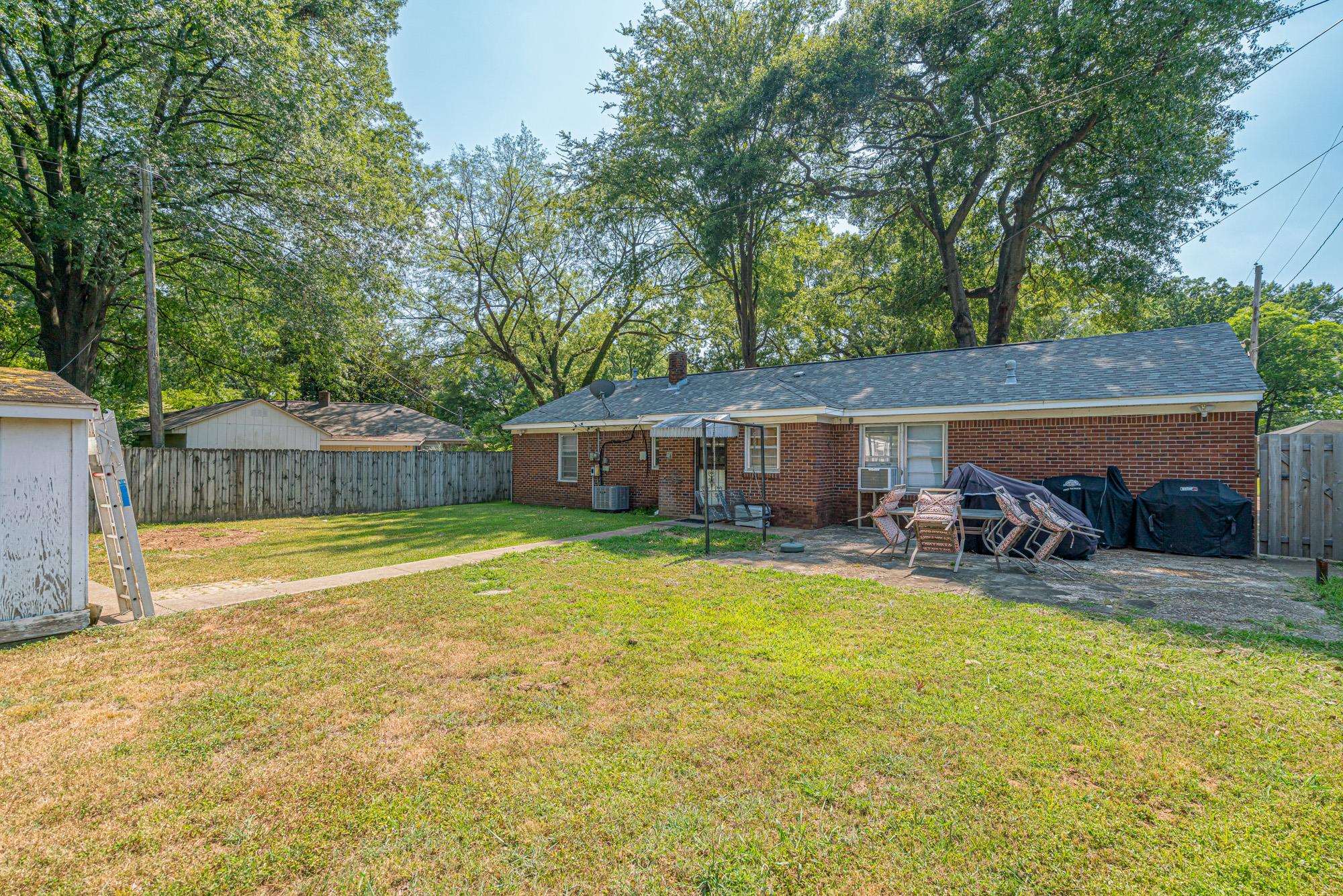 1632 South Perkins Road Memphis, TN 38117 - Photo 3 of 25 a view of a swimming pool with a patio and a yard
