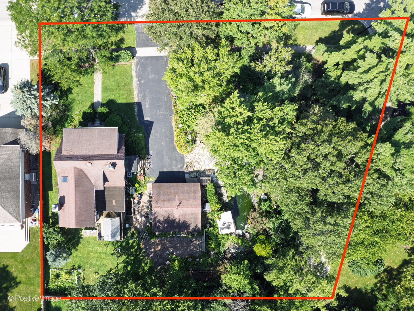 245 Middaugh Road Clarendon Hills, IL 60514 - Photo 1 of 10 an aerial view of a house with a yard and garden