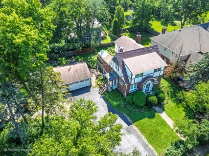 an aerial view of a house with a garden
