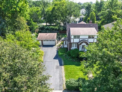 an aerial view of a house with a garden