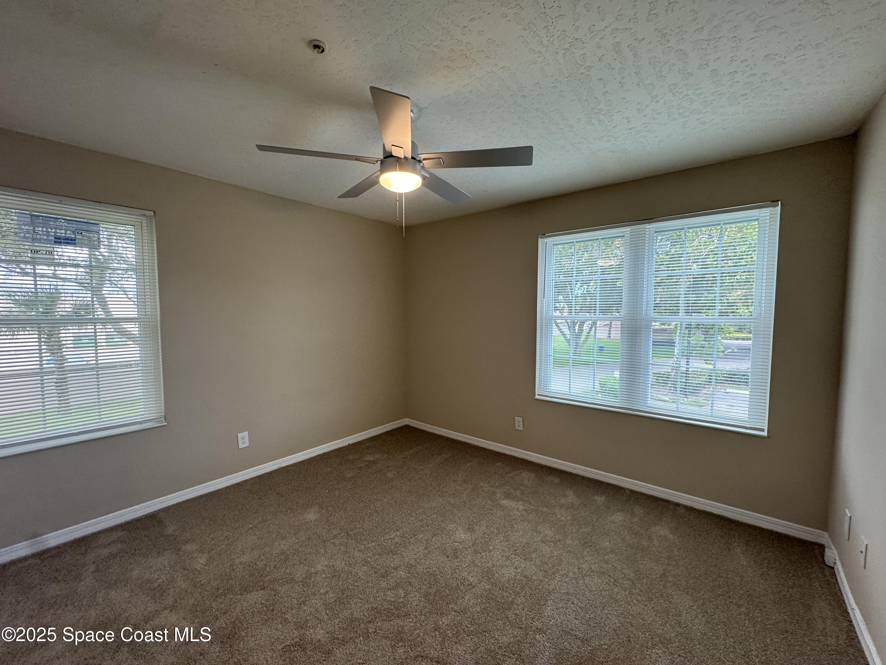 7667 North Wickham Road, Unit 1515 Melbourne, FL 32940 - Photo 18 of 36 a view of an empty room with a window