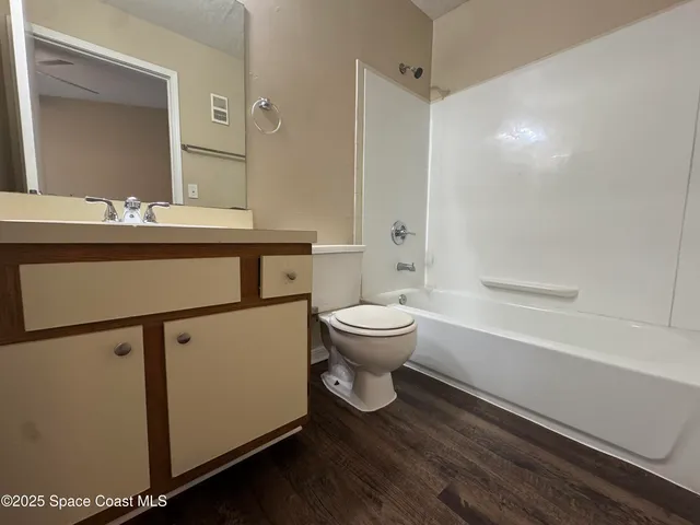 a bathroom with a sink a toilet and a bathtub