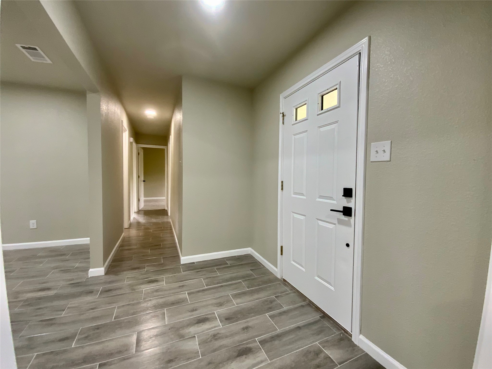 296 Kings Row Street Livingston, TX 77351 - Photo 24 of 35 Hallway - Vinyl Plank Flooring