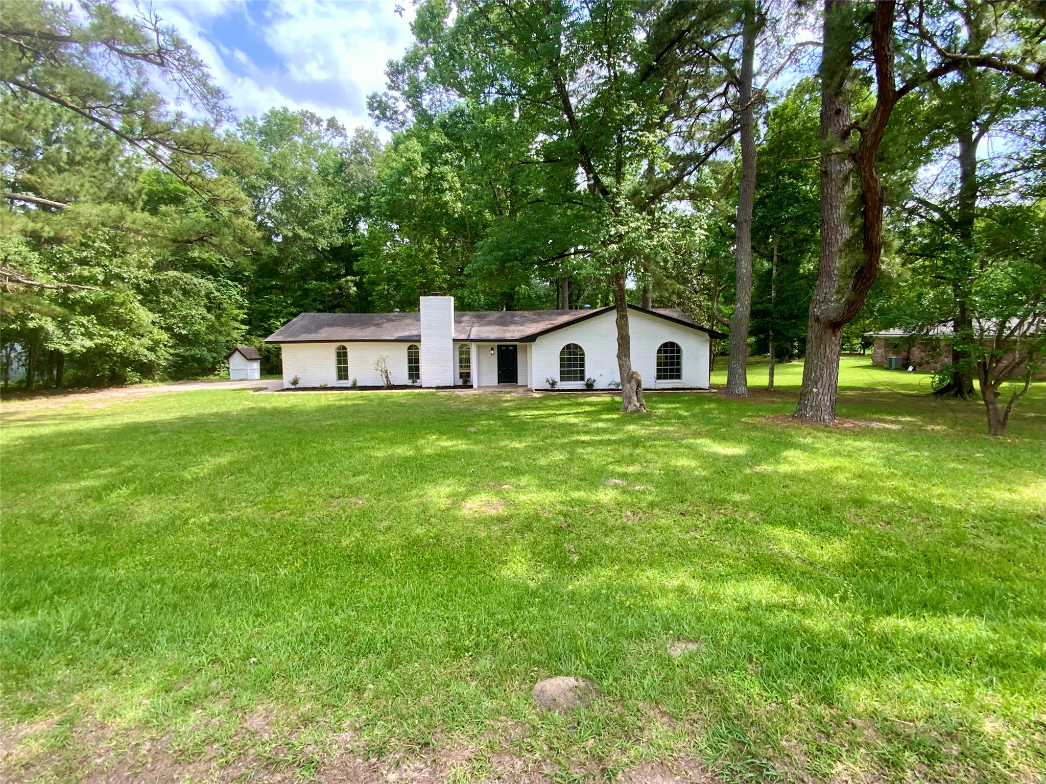 296 Kings Row Street Livingston, TX 77351 - Photo 3 of 35 Sits back off the road on over 1/3 Acre