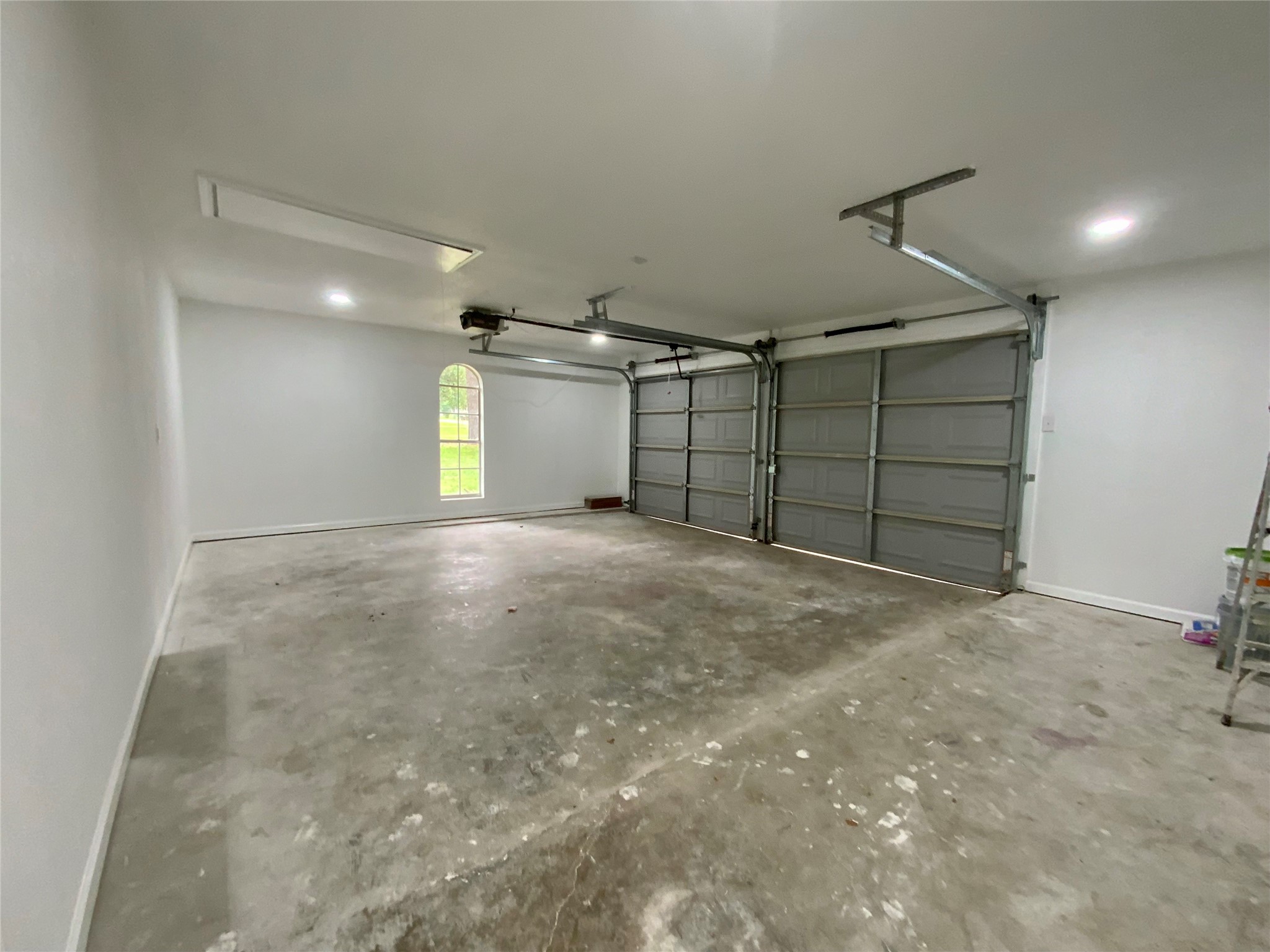 296 Kings Row Street Livingston, TX 77351 - Photo 35 of 35 Finished Garage with Arch Window could easily be taken in for additional Bedroom OR Game Room!