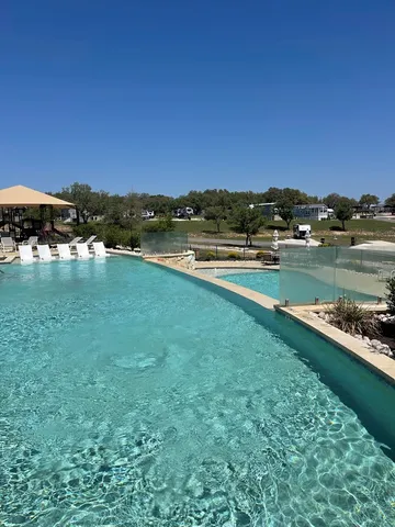 a view of a lake with houses in the back
