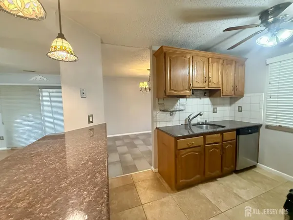 a spacious bathroom with a sink and a mirror