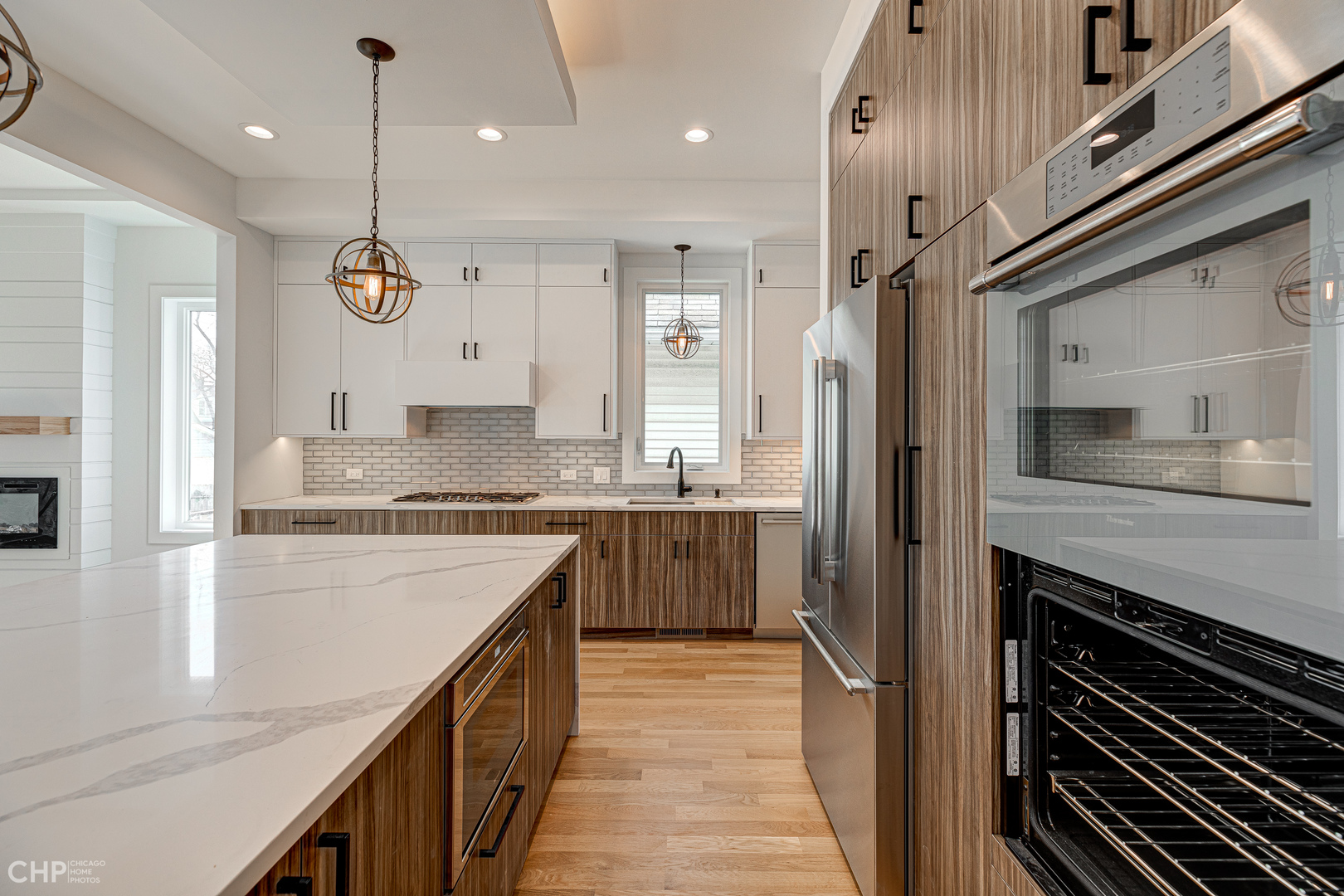 3711 North Spaulding Avenue Chicago, IL 60618 - Photo 11 of 35 a kitchen with a sink stove and refrigerator